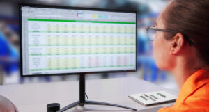 roofing plan manager looking at spreadsheet for parts planning