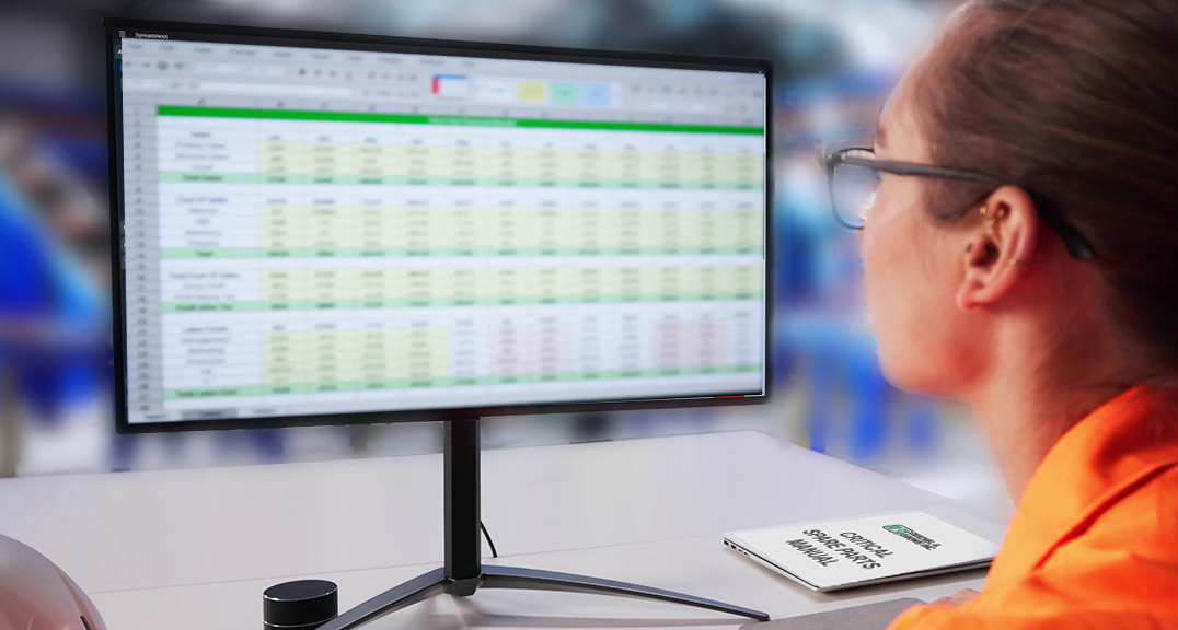 roofing plan manager looking at spreadsheet for parts planning